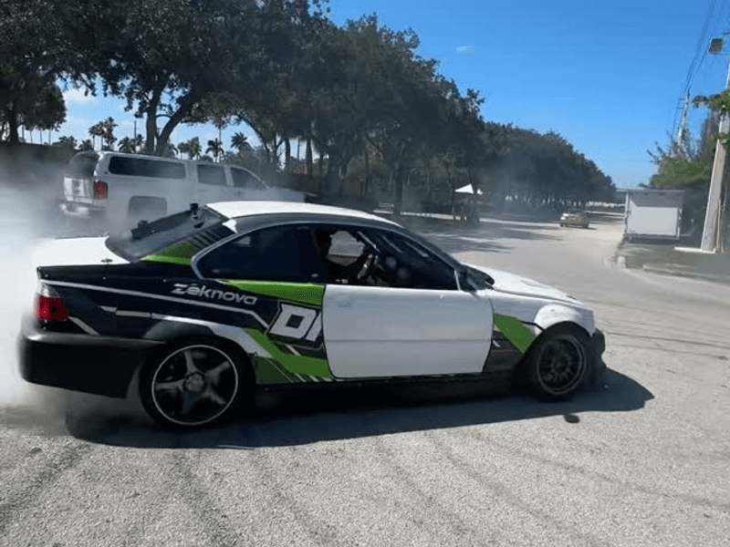 Drift car mid-slide at a South Florida track event