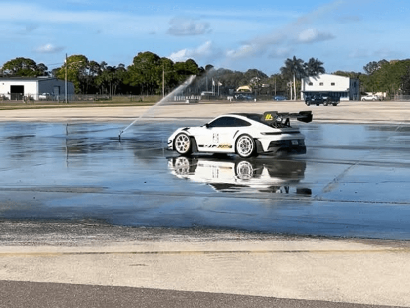 Porsche GT3 on the skid pad at a car control clinic